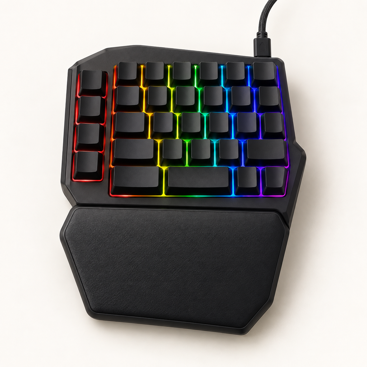 Black one-handed mechanical gaming keypad with RGB backlighting and wrist rest